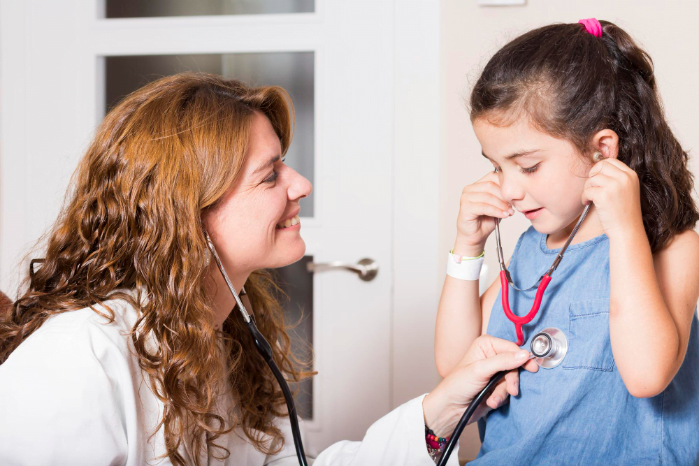 Pediatrician checking child